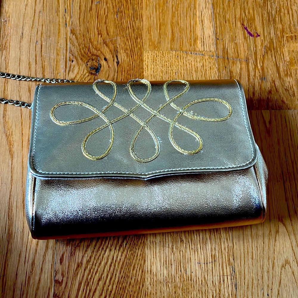 Vintage HL gold handbag. Small. Some signs of wear because its….well, vintage.